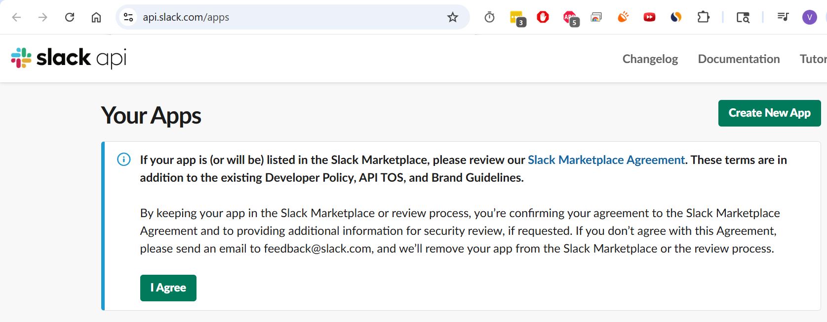 Slack API Your Apps page with a green Create New App button on the right and a Marketplace Agreement panel below.